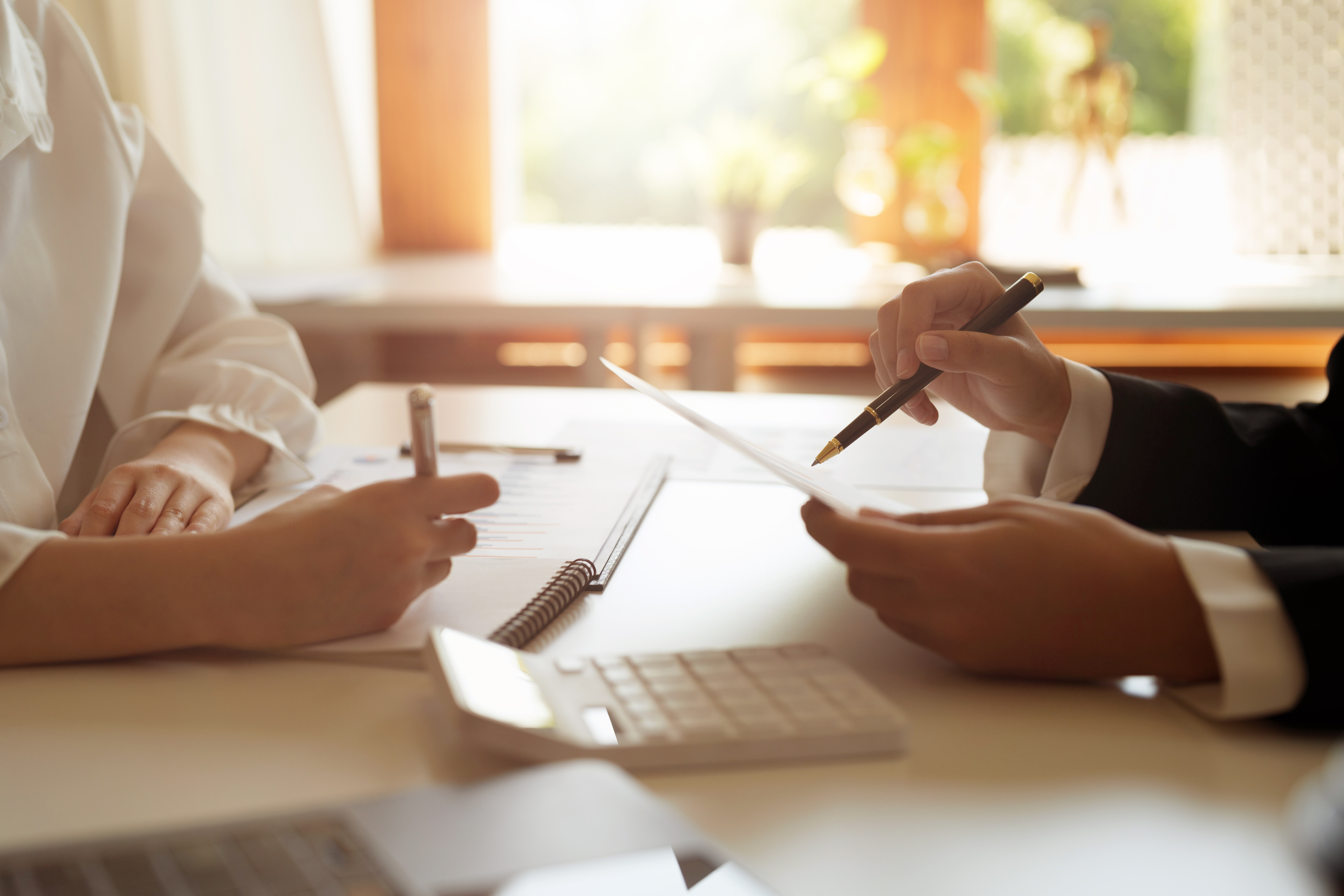 two business woman investment consultant analyzing company annua